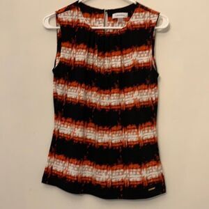 Calvin Klein sleeveless multi colored blouse. Length 24” Size S. Keyhole back